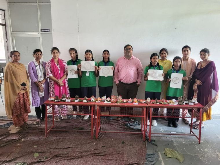 Teachers and students with certificates at the Ganesh Chaturthi craft competition, Janhit World School