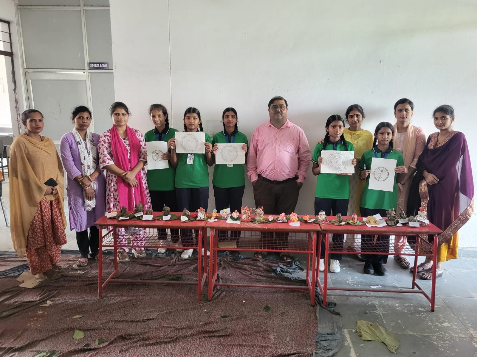 Teachers and students with certificates at a school competition, Janhit World School