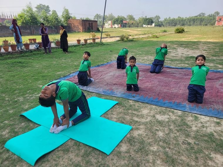 A yoga session in progress on the campus ground at Janhit World School