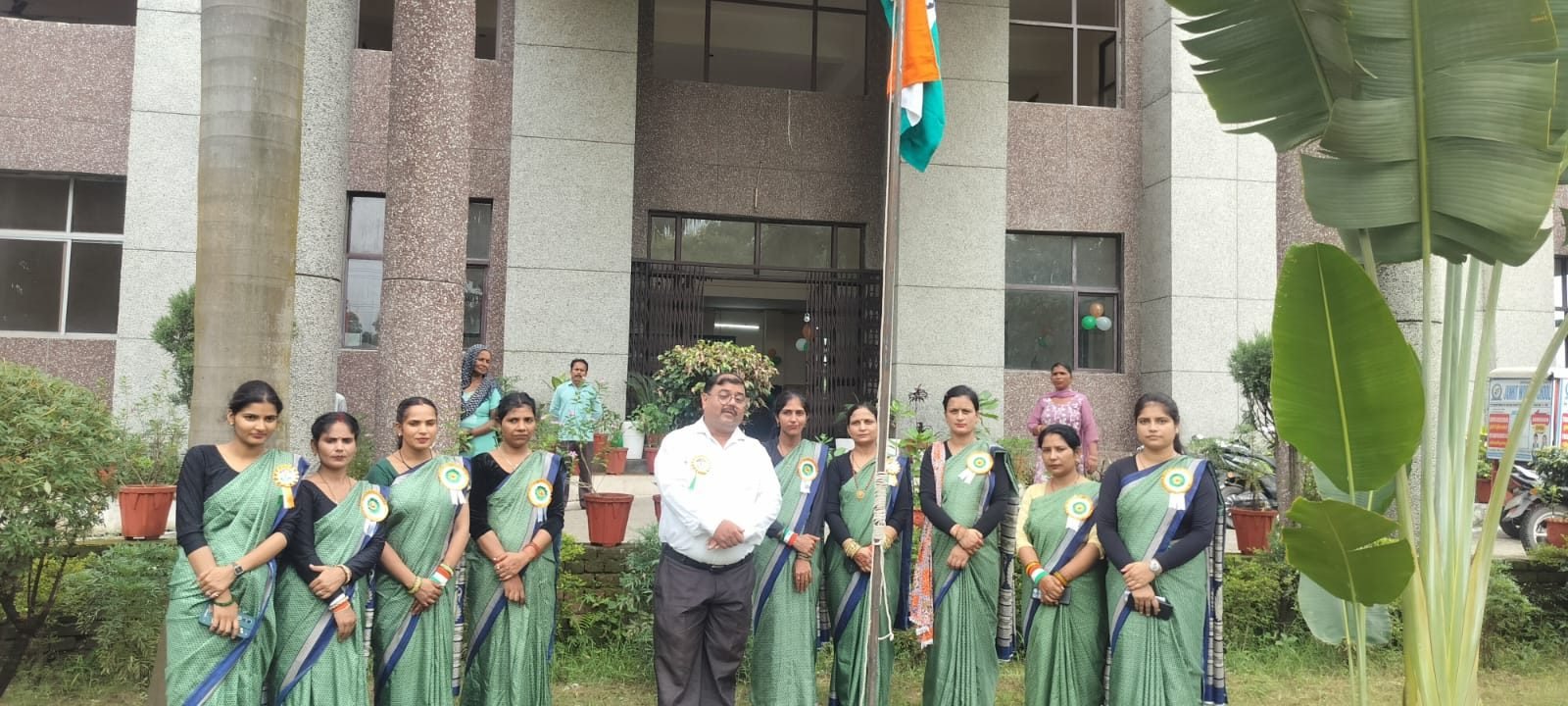 Teachers of Janhit World School at the flag hoisting ceremony in front of the school building