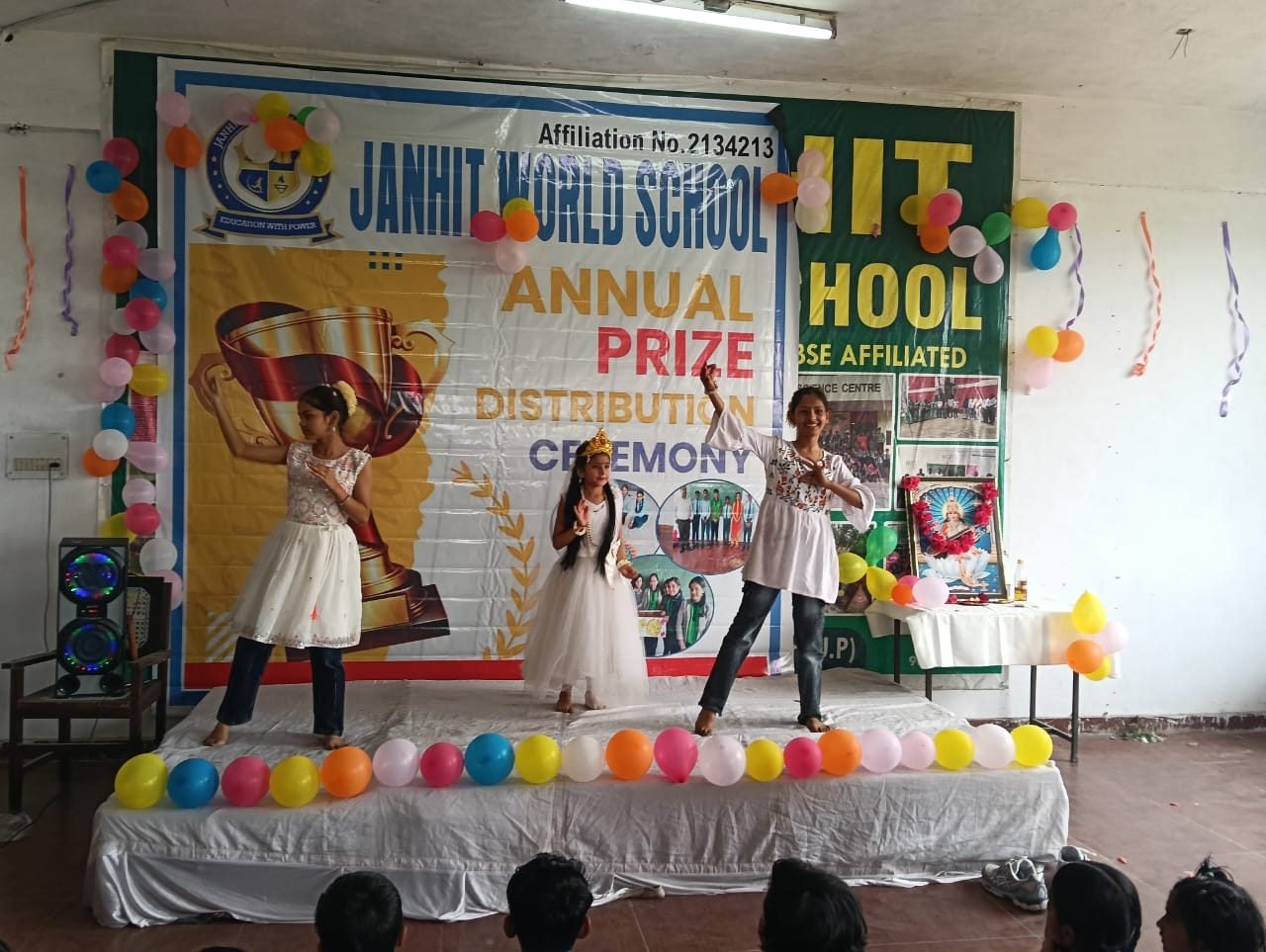 Students of Janhit World School performing on stage at the annual ceremony