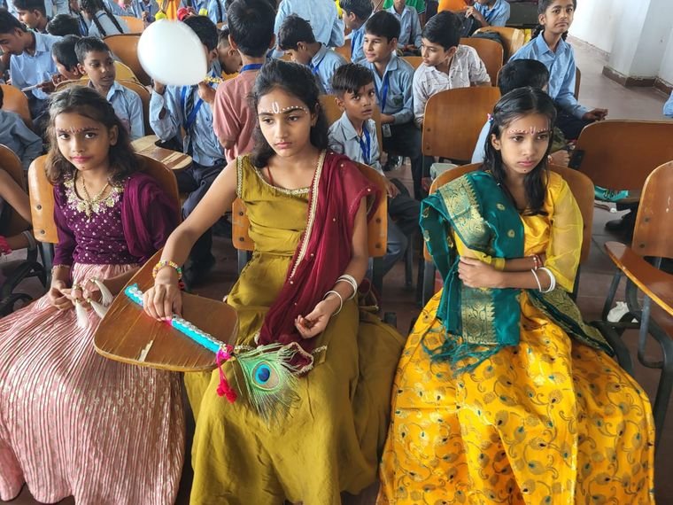 Students of Janhit World School dressed for the Krishna theme Janmashtami celebration
