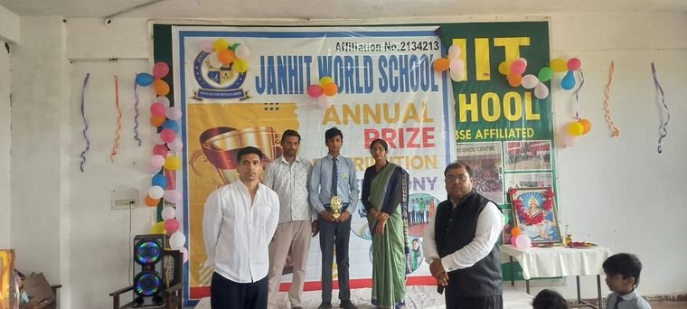 Staff and student award winners on stage at the Annual Prize Distribution Ceremony, Janhit World School